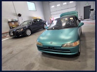 a blue car is parked in a garage